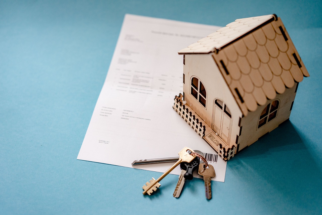 House keys and contract paperwork representing the trusted guidance of a real estate agent in San Diego.