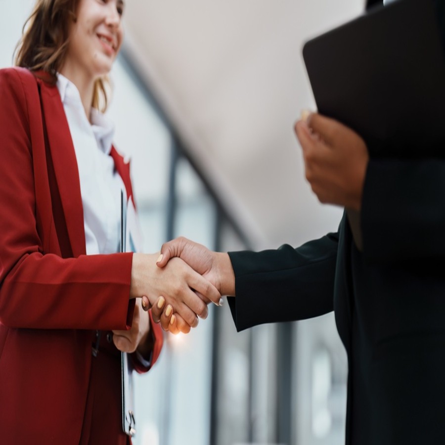 How to buy a home in San Diego professional handshake symbolizing a new home purchase